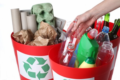 Workers managing construction waste for proper disposal in Southgate